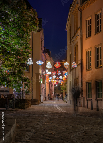 Street of the night city of Luxembourg with glowing laterns
