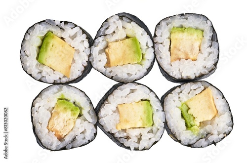 Close-up of fresh cucumber and omelette sushi rolls isolated on white background.