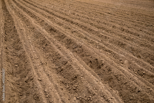 Empty plowed field at the beginning of spring season
