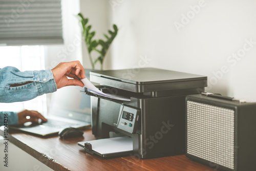 Wallpaper Mural The man using the laser printer. Torontodigital.ca