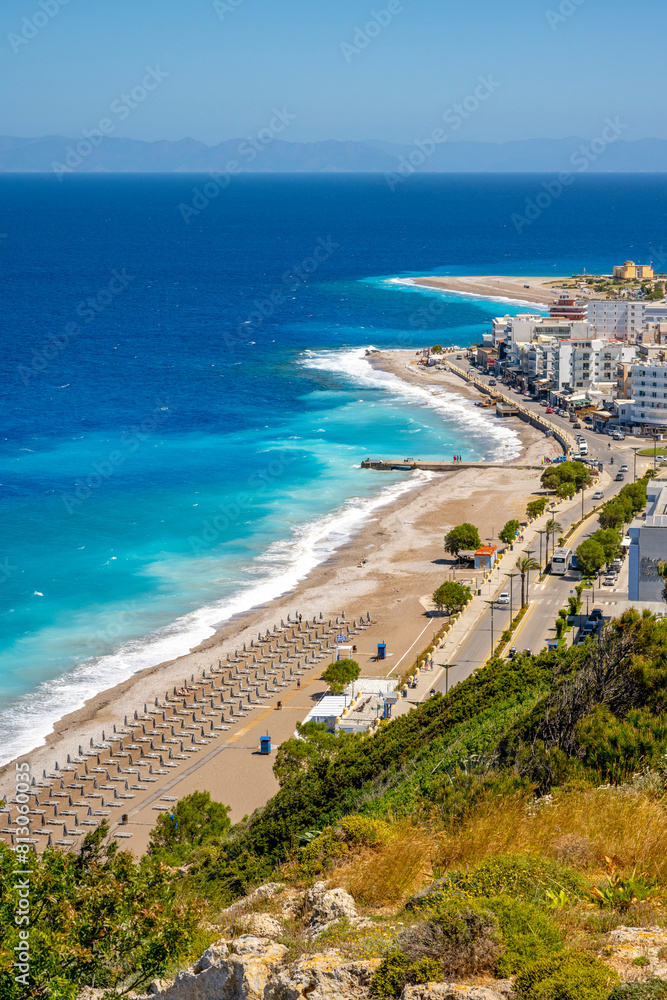 Fototapeta premium Aegean beach with sunshades in city of Rhodes (Rhodes, Greece)