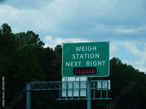 Highway weigh station sign, closed notification. photo