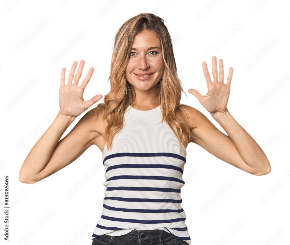 Caucasian blonde woman in studio showing number ten with hands. Caucasian blonde woman in studio showing number ten with hands.