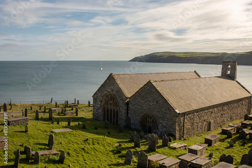 St. Hywyn's Church, Aberdaron, Wales in evening sunlight. An important place of pilgrimage which is part of the North Wales Pilgrim's Way.