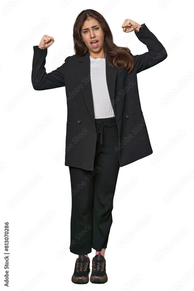 Middle Eastern in business attire raising fist after a victory, winner concept. Middle Eastern in business attire raising fist after a victory, winner concept.