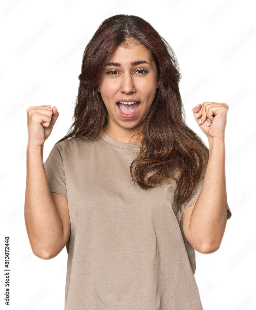 Middle Eastern woman in studio cheering carefree and excited. Victory concept. Middle Eastern woman in studio cheering carefree and excited. Victory concept.