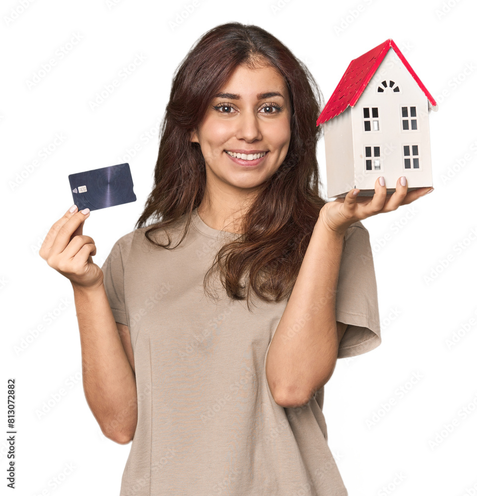 Young Middle Eastern woman with credit card and a house Young Middle Eastern woman with credit card and a house