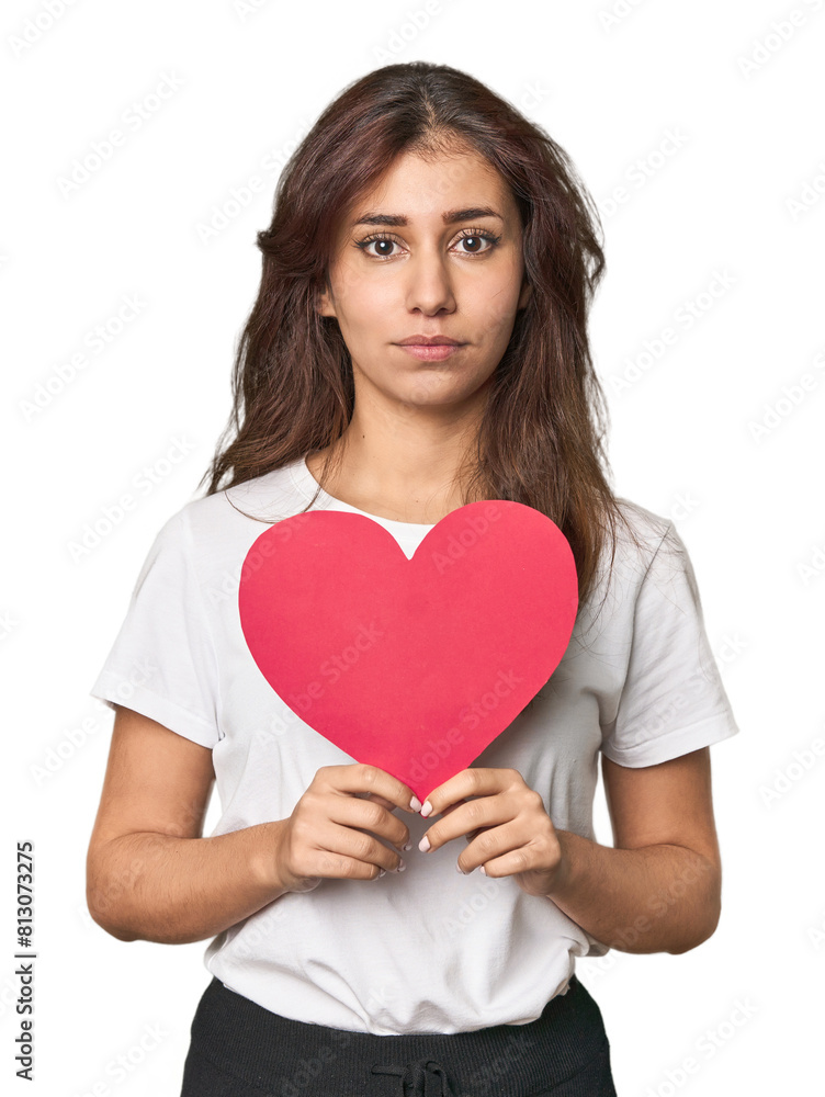 Young Middle Eastern woman holding paper heart, love concept Young Middle Eastern woman holding paper heart, love concept
