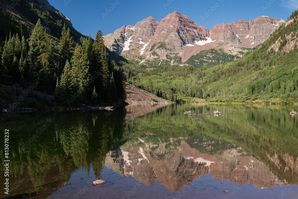 14,163 Ft. Maroon Peak and 14,019 Ft. North Maroon Peak rise above a vast wilderness South of Aspen Colorado.