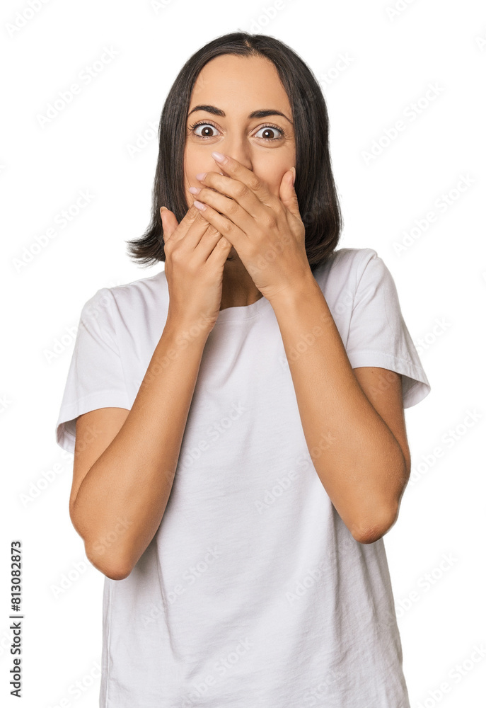 Young Caucasian woman with short hair laughing about something, covering mouth with hands. Young Caucasian woman with short hair laughing about something, covering mouth with hands.