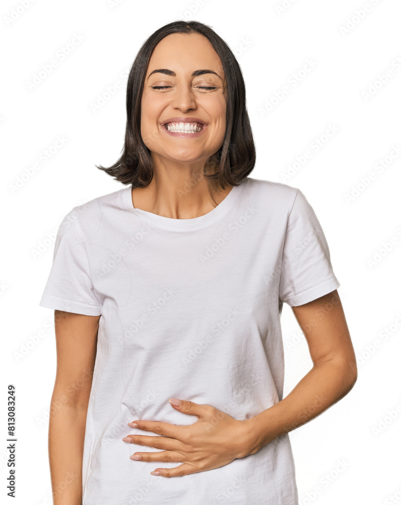 Fototapeta premium Young Caucasian woman with short hair touches tummy, smiles gently, eating and satisfaction concept.