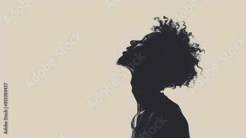 A silhouette of a person with their head thrown back in laughter on light background