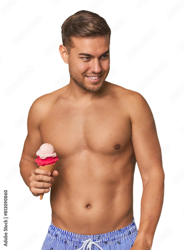 Man in swimsuit enjoying ice cream, a perfect summer indulgence Man in swimsuit enjoying ice cream, a perfect summer indulgence
