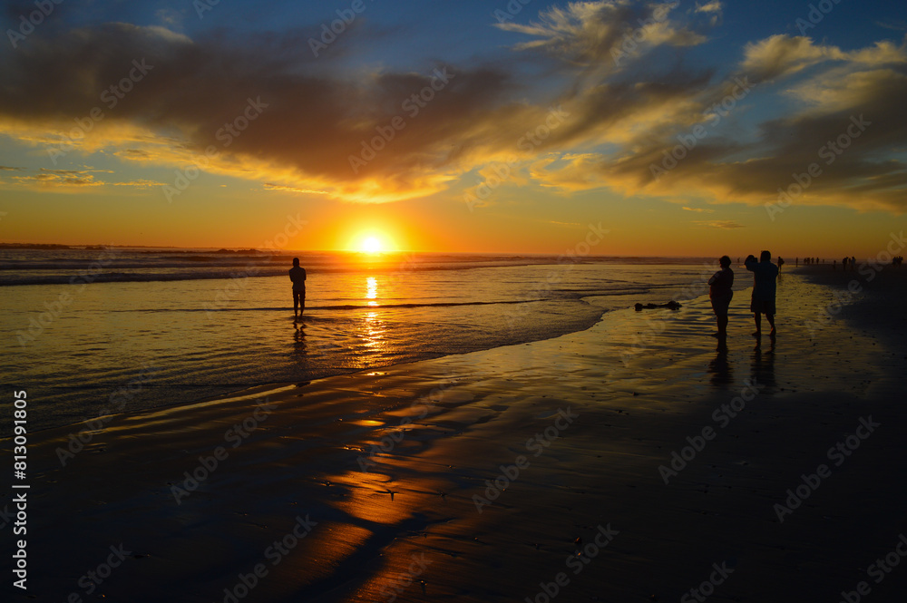 Dramatic and beautiful setting sun at sunset beach Dramatic and beautiful setting sun at sunset beach