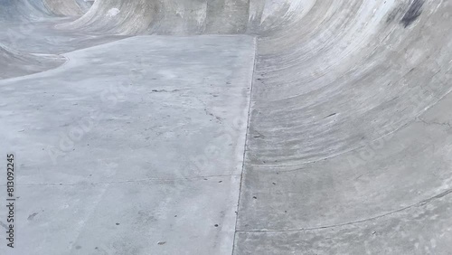Public playground for a skateboard in a recreation park. No people.