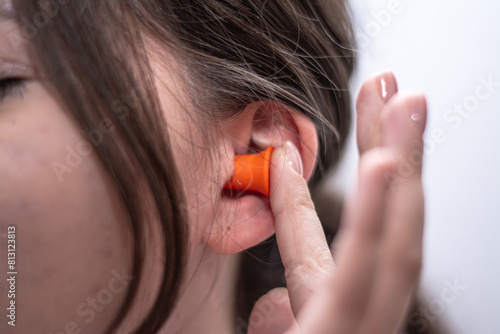 Wallpaper Mural Woman outting earplug in her ear Torontodigital.ca