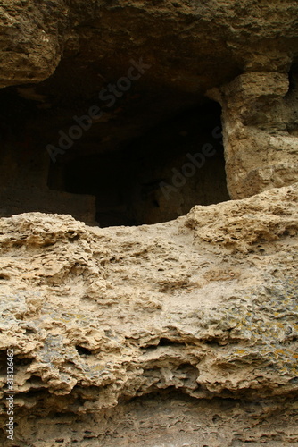 A large rock with a hole in it photo