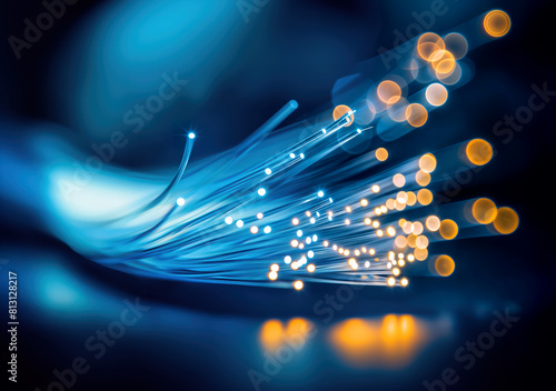 A blue fiber optic cable with a glowing blue light at the end.