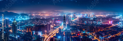 Illuminated Cityscape at Night from a High Vantage Point: A Mixture of Urban and Natural Elements photo