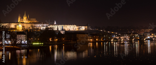 Illuminated Hradcany  Prague Castle   and Charles Bridge   St. Vitus Cathedral and St. George church  medieval architecture  Vltava river at night  Bohemia  Czech Republic.