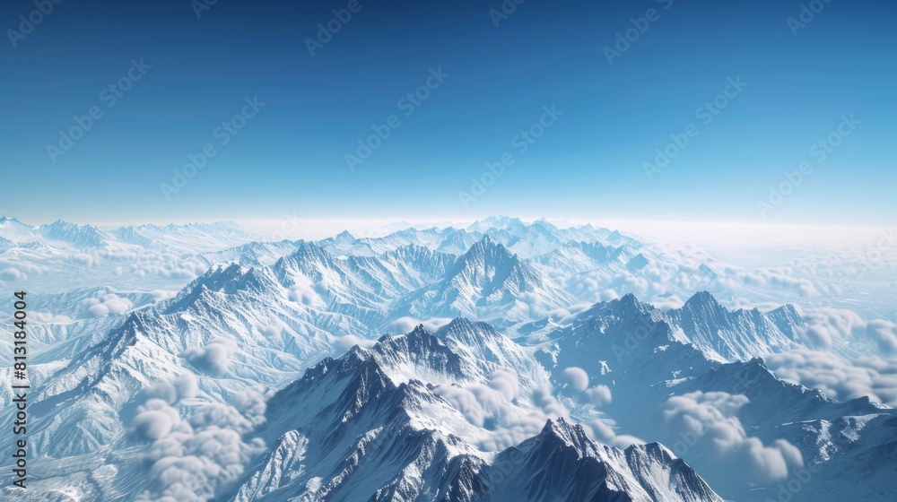 A panoramic view of snow-covered peaks stretching into the distance, under a clear blue sky. A panoramic view of snow-covered peaks stretching into the distance, under a clear blue sky.