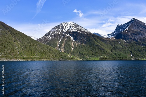Norwegian Fjords. hjørundfjord. Sunny day in snowy mountains. 