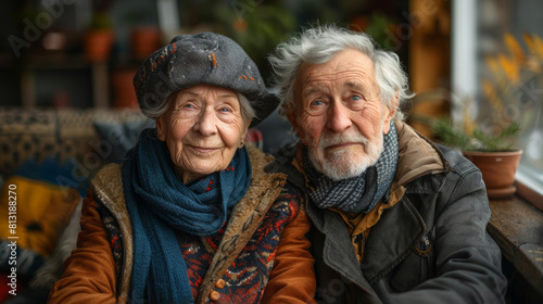 Portrait of an elderly couple wrapped in warm scarves, sharing a moment together outdoors on a chilly day.  © vladimir