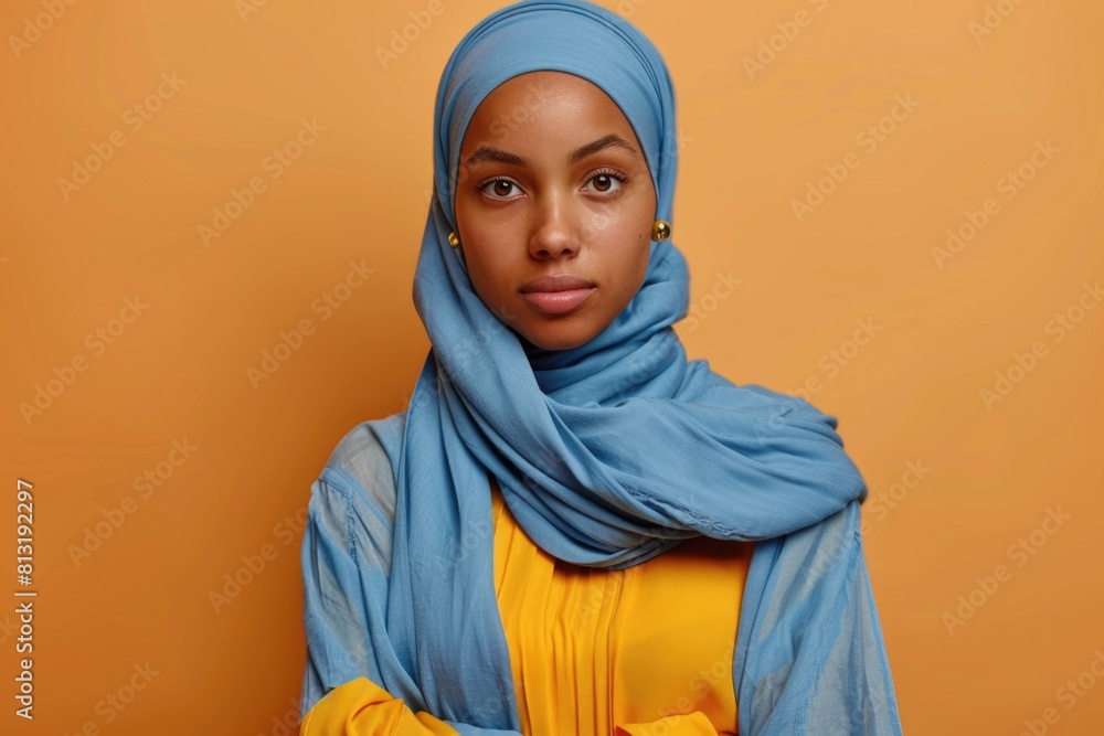 A woman wearing a blue scarf A woman wearing a blue scarf