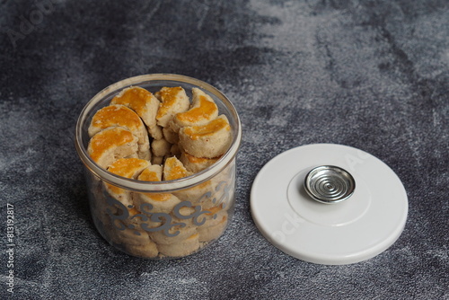 Kue kacang, peanut cake with crescent shaped in a jar or peanut cookies. It is a traditional Indonesian food served to celebrate Ied Fitr, Ied Mubarak photo