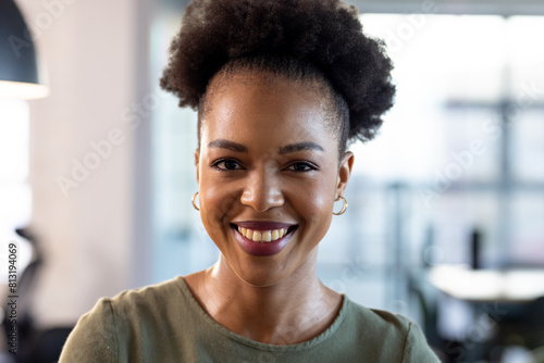 At office, African American businesswoman smiling, wearing casual clothes photo