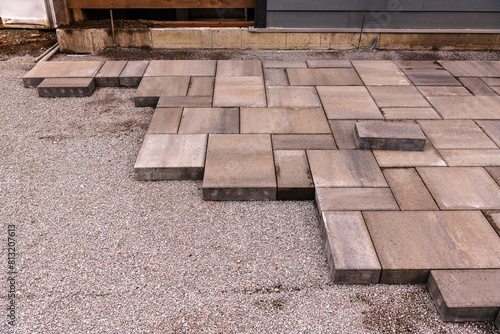 Photography home construction: patio and walkway paving stone instalation in progress at a n