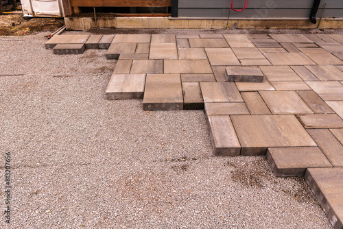 home construction: patio and walkway paving stone instalation in progress at a new house build in an older toronto residential neighbourhood room for text photo