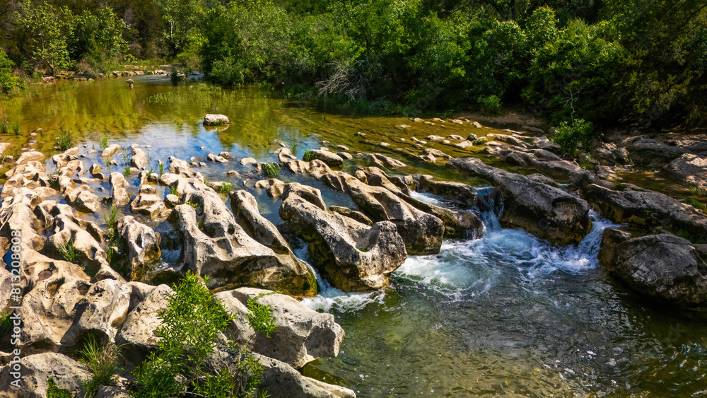 Scenic aerial view of Sculpture Falls via Barton Creek Greenbelt Trail
