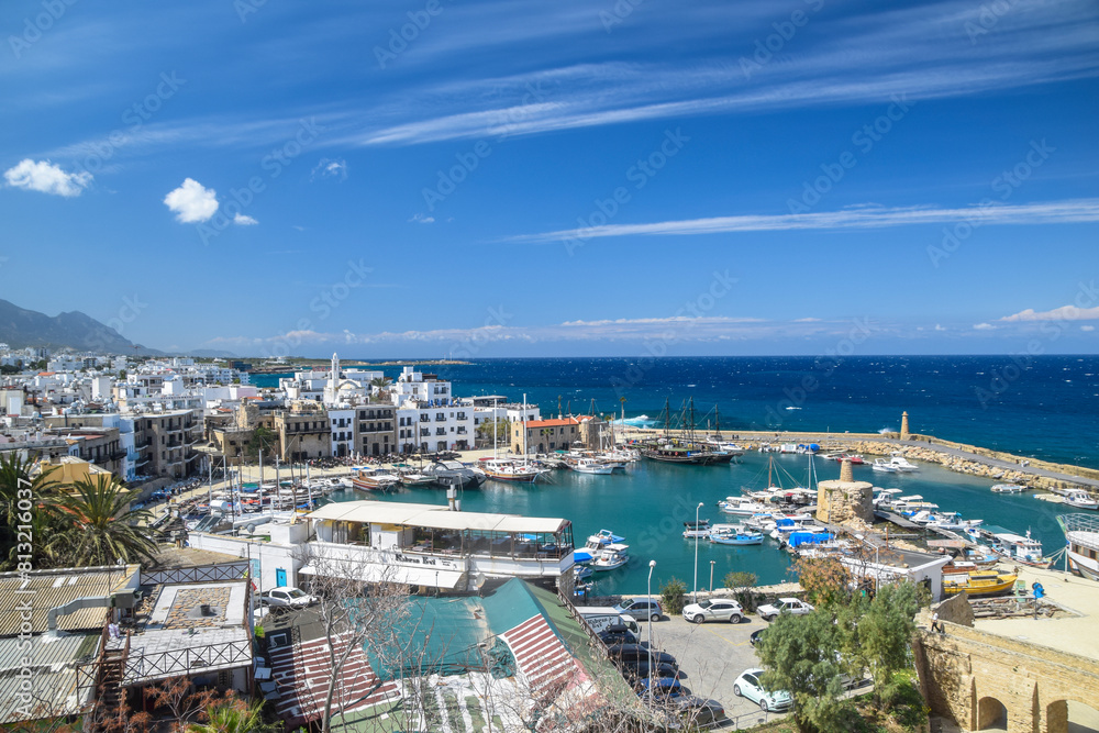 Fototapeta premium view of Kyrenia (Girne) old harbour on the northern coast of Cyprus. Kyrenia seaside of Mediterranean Sea, Cyprus. Famous places and travel destination of Northern Cyprus