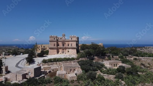 Aerial view of the Selmun palace and surrounding farmhouses with Mediterranean sea in the back. High quality 4k footage photo