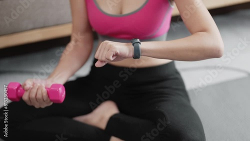 woman using dumbbell for Arm workout at home photo