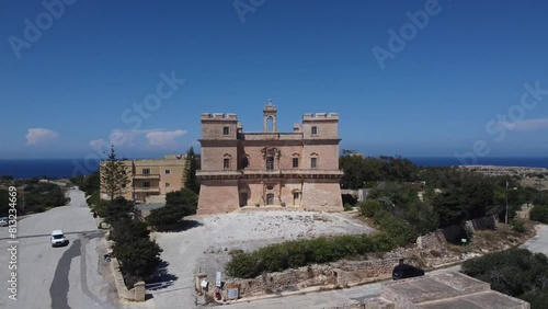 Aerial view of the Selmun palace and surrounding farmhouses with Mediterranean sea in the back. High quality 4k footage photo