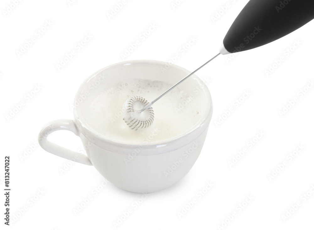 Whisking milk in cup with mini mixer (frother wand) isolated on white Whisking milk in cup with mini mixer (frother wand) isolated on white