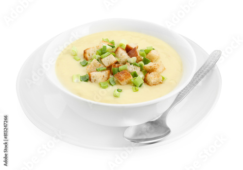 Tasty potato soup with croutons in bowl and spoon isolated on white