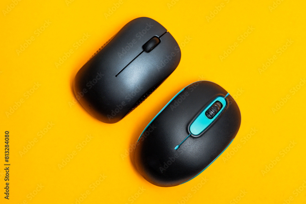 Bluetooth mouse isolated on yellow background Bluetooth mouse isolated on yellow background