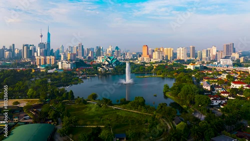 Aerial Hyperlapse of Kuala lumpur city with lake view overseeing Kuala lumpur city during sunrise