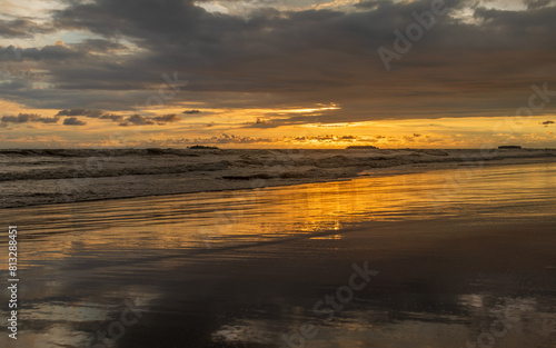 reflection of clouds at beach © Johnster Designs