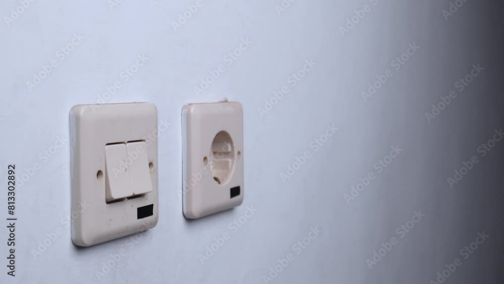 unplugging the cable by hand from the wall outlet unplugging the cable by hand from the wall outlet