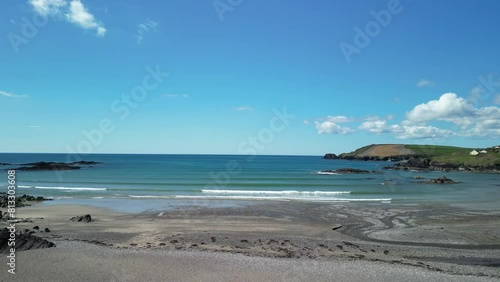 Sunny blue day in May at the Owenachincha beach in West Cork, an aerial footage over calm waters of Atlantic Ocean photo