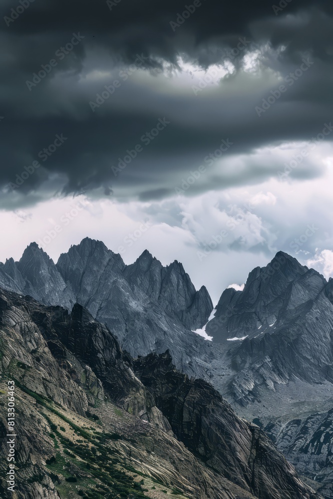 Obraz premium A rugged mountain range obscured by dark clouds, with jagged peaks disappearing into the gloom of an approaching storm, Generative AI