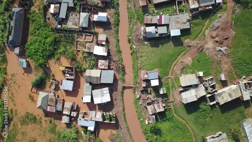 African village with houses and river. Bukasa, Kampala, Uganda. Aerial top down view. photo