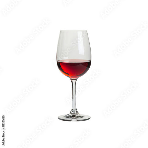 A wine glass is filled with red wine