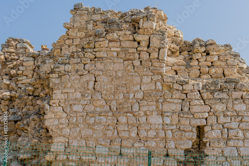 A close-up of ruins of ancient stone wall with visible textures, part of a historic site, in Pamukkale, Turkiye