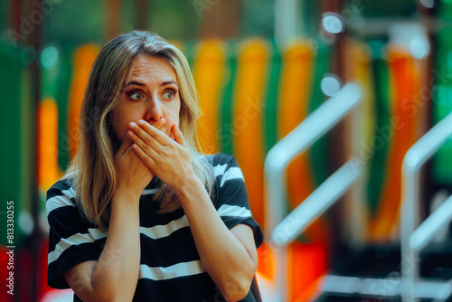 Fotografie Woman Feeling Sick Covering her Mouth in a Park