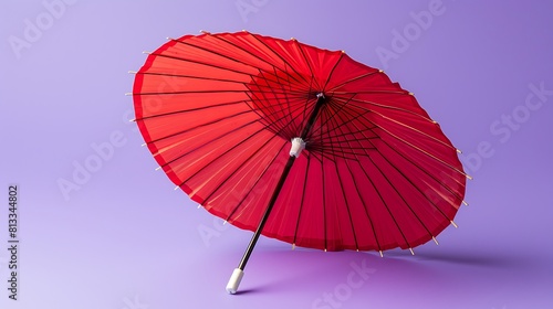 red cocktail umbrella isolated on purple background